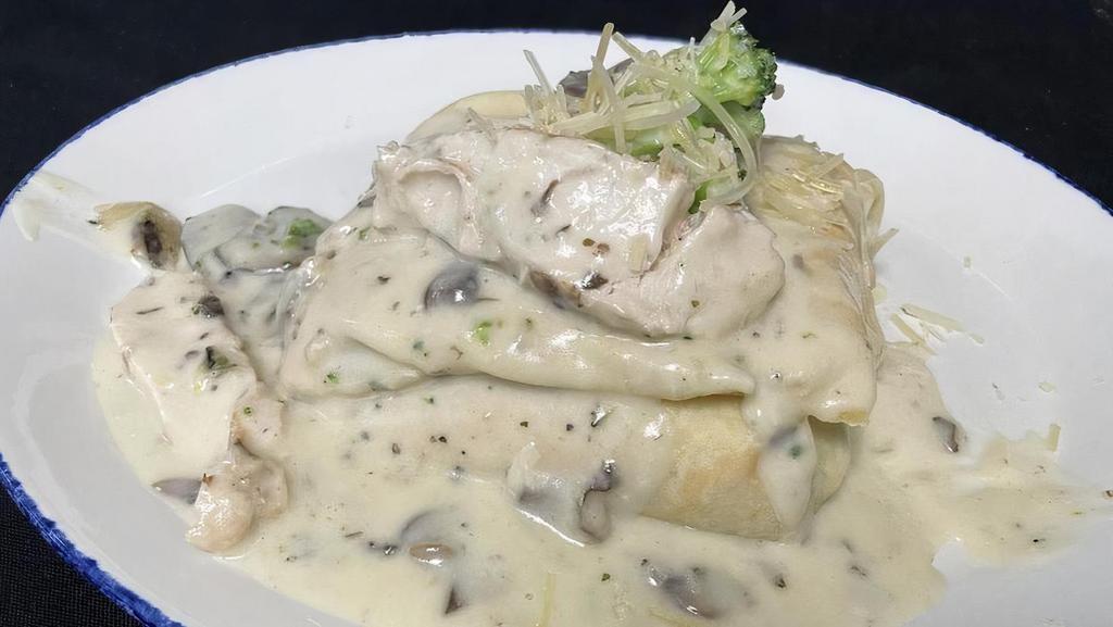 Chicken Tarragon Crepe · Grilled chicken, broccoli & mushrooms in a tarragon cream sauce with aged parmesan