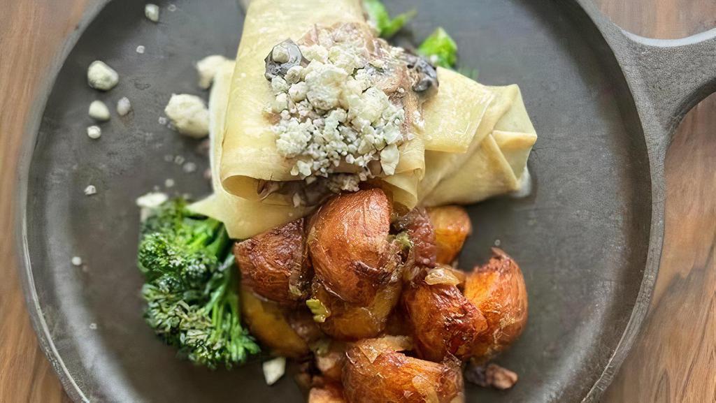 Short Rib & Charred Broccolini · Crepe stuffed with five-hour braised short rib and an herbaceous blend of. shallots, mushrooms & crumbled bleu.. Served with warm maple mustard potatoes and charred broccolini.