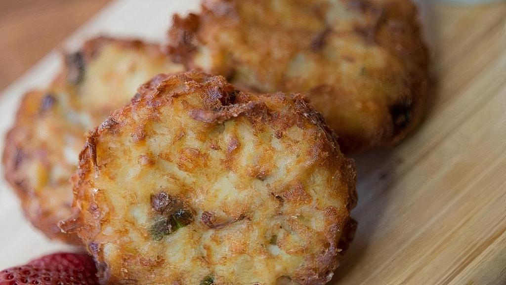 Hashbrown Patties · Three patties stuffed with cheddar and scallions. Served with sour cream.