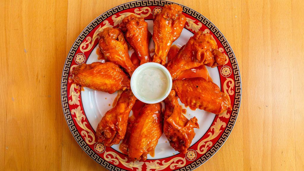 Buffalo Wings · Hormone-free jumbo party wings served with your choice of blue cheese or ranch dipping sauce and choice of sauce.