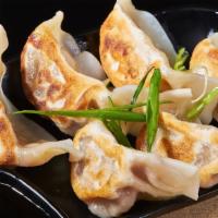 Peking Ravioli · Pork dumplings served with ginger sauce.