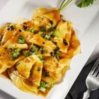 Spicy Wontons · Sauteed pork wontons with a spicy peanut sauce.