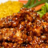Sesame Chicken · Served with rice and vegetables.