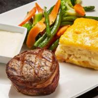 Filet Mignon Wrapped In Bacon · Filet (6oz) served with gorgonzola cream sauce, scallop potatoes, steamed vegetable medley.