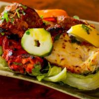 Combination Platter · Malai kabab, chicken tikka, kakri kabab & seafood.