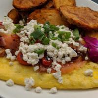 Smoked Salmon & Goat Cheese Omelette · Fresh smoked salmon, goat cheese, red onion, tomato, scallions inside.  Comes with breakfast...