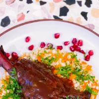 Winter Lamb Oso Bucco · Slow cooked lamb shank with pomegranate molasses, herbed Israeli couscous and braised carrots