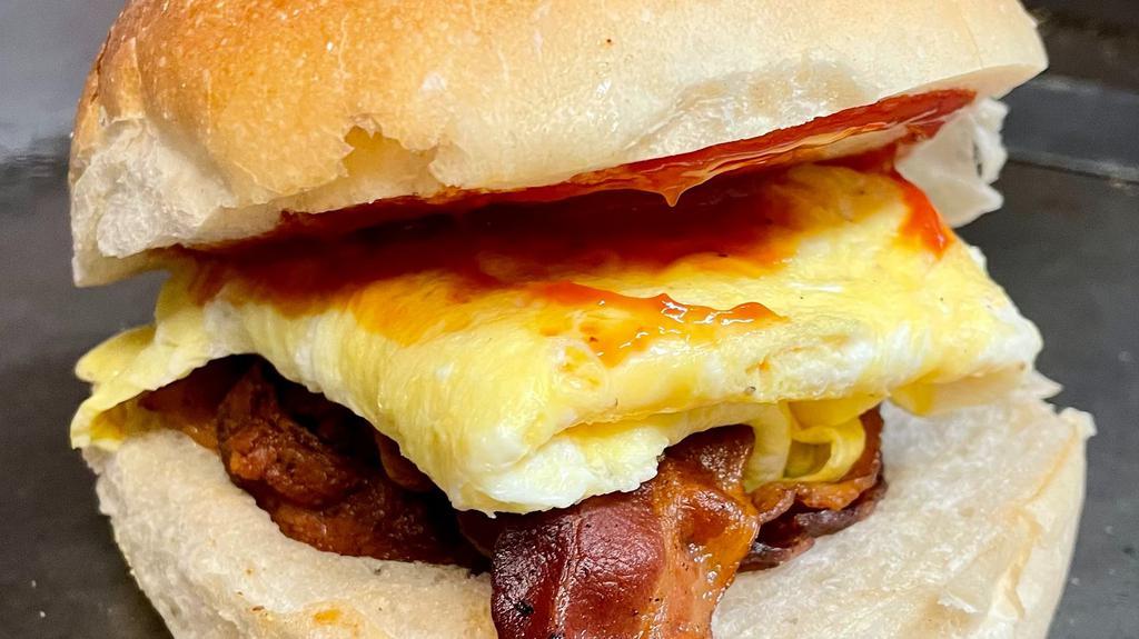 Breakfast Sandwich · Favorite. Two eggs, cheese and choice of meat on a kaiser roll.