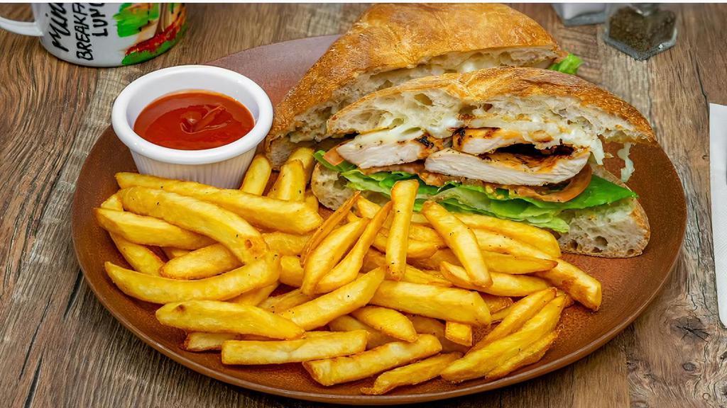 Grilled Chicken Sandwich · Grilled chicken breast, lettuce, tomato, mozzarella cheese, and mayo on Ciabatta bread. With French fries.