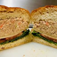 Tuna Fish Salad Sandwich · Tuna fish salad on a roll with lettuce and tomato. With French fries.