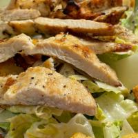 Grilled Chicken Caesar Salad · Marinated breast chicken cooked in a charbroiler grill with romain lettuce, parmigiano chees...