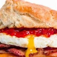 Bacon, Egg & Cheese Buttermilk Biscuit · Bacon, egg, cheddar cheese, and tomato jam on a buttermilk biscuit