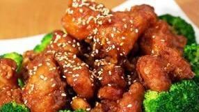Sesame Chicken · Shredded flank chicken marinated with garlic wine & special sauce showered with sesame seeds on top.