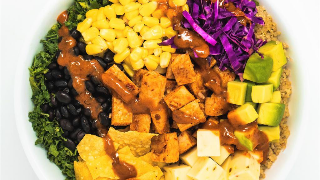 Southwest Quinoa (Grain Bowl) (Gf) · kale and quinoa, avocado, corn, purple cabbage, pepper jack cheese, tortilla chips, black beans, spicy grilled chicken and chipotle vinaigrette.