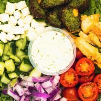 Falafel-Osophy · kale + romaine, grape tomatoes, red onions, cucumbers, pita chips, feta cheese, falafel, hum...