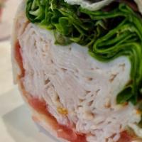 Classic Turkey Wrap · Turkey, Lettuce and Tomato on a Wrap.
