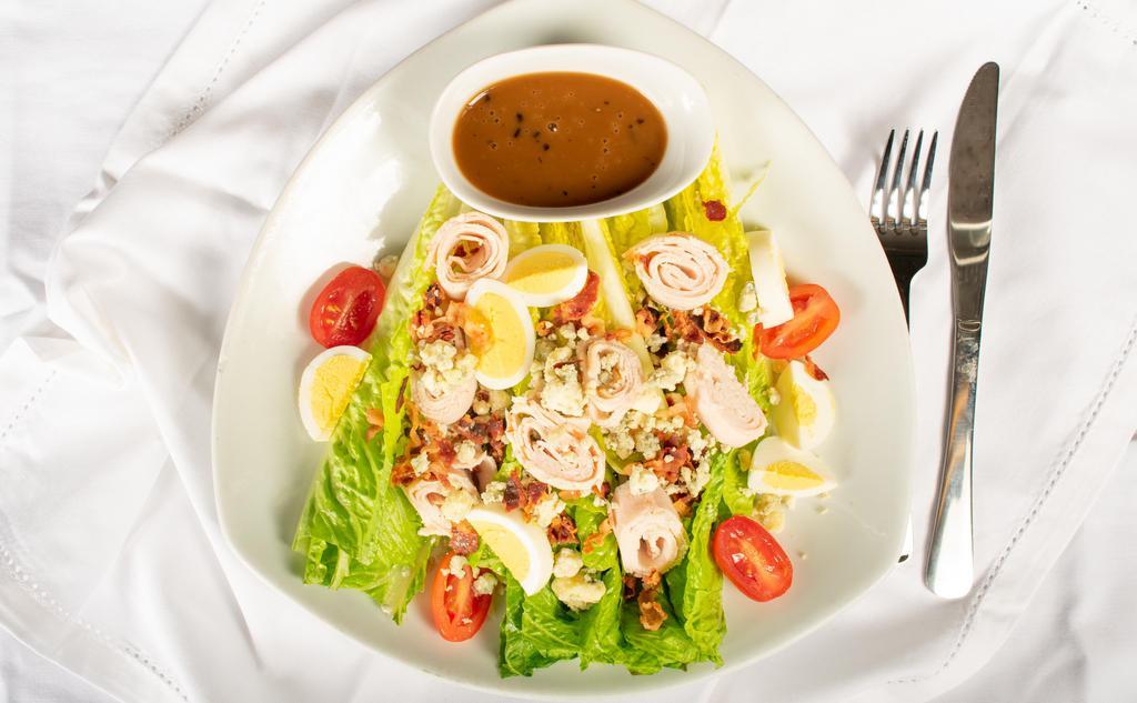 Cobb Salad
 · Romaine Lettuce, Turkey, Bacon, Hard Boiled Egg and Crumble Blue Cheese with Blue Cheese Dressing