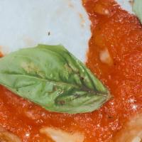 Grandma Pie · Thin crispy crust topped with margherita sauce, fresh mozzarella and basil. Basil on the top...