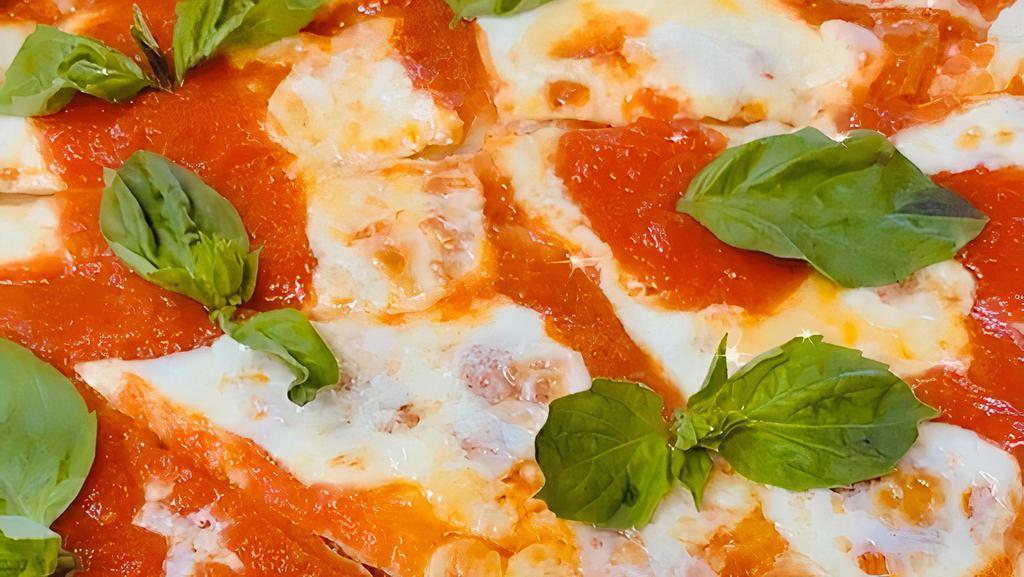 Margherita Pie · With fresh mozzarella, plum tomatoes, garlic and basil, and fresh basil on the top.