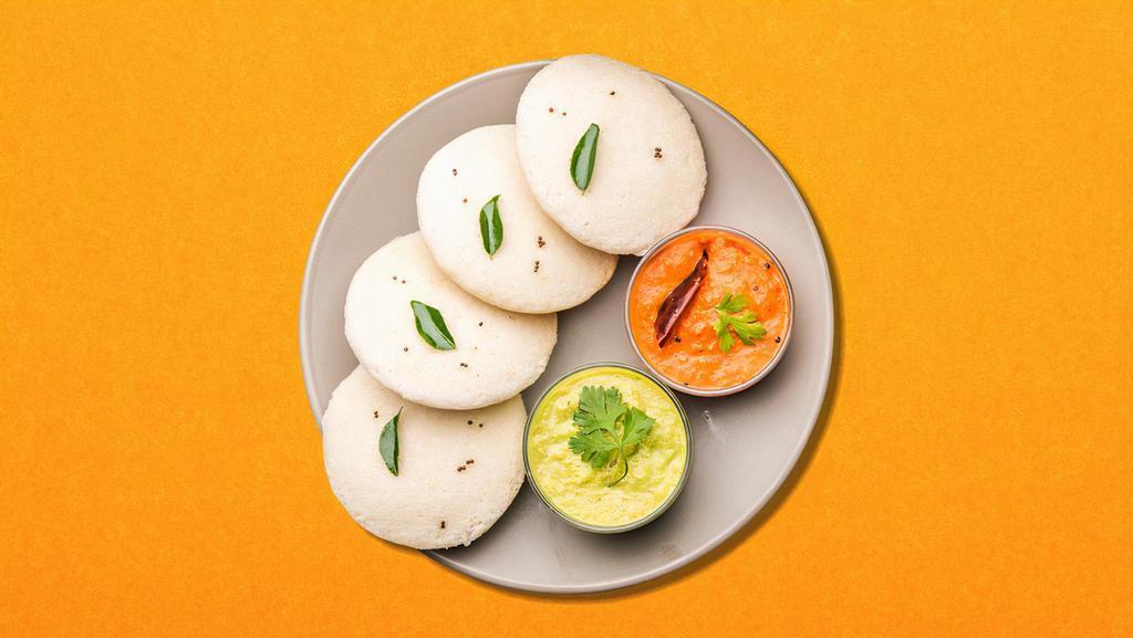 Lentil-Rice Cake (3 Pcs) · Steamed savory rice cakes served with a lentil soup, a tangy tomato, and classic coconut relish.