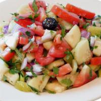 Shepherd Salad · Freshly diced tomatoes, cucumbers, green peppers, onions, parsley, olives, olive oil and lem...