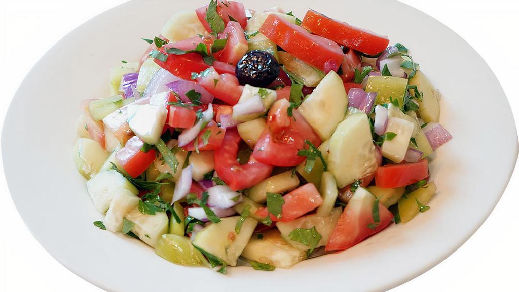 Shepherd Salad · Freshly diced tomatoes, cucumbers, green peppers, onions, parsley, olives, olive oil and lemon juice.