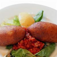 Kibbeh (Icli Kofte) · Cracked wheat stuffed with ground meat, walnuts and herbs.