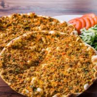 Lahmacun (2 Pieces) · Anatolian version of ancient Turkish meat pie with ground lamb topped with parsley, fresh to...
