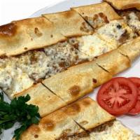 Ground Meat Pide · A flattened dough served with ground meat and mozzarella cheese with melted butter on top.