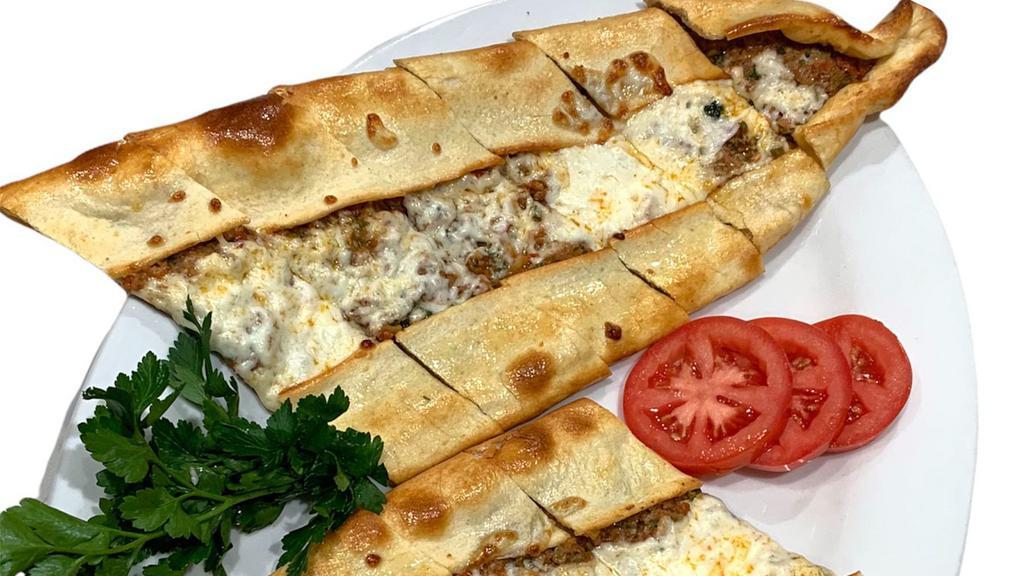 Ground Meat Pide · A flattened dough served with ground meat and mozzarella cheese with melted butter on top.
