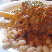 Braised Lamb Shank With White Beans · Slow cooked, brown tomato sauce, white beans.