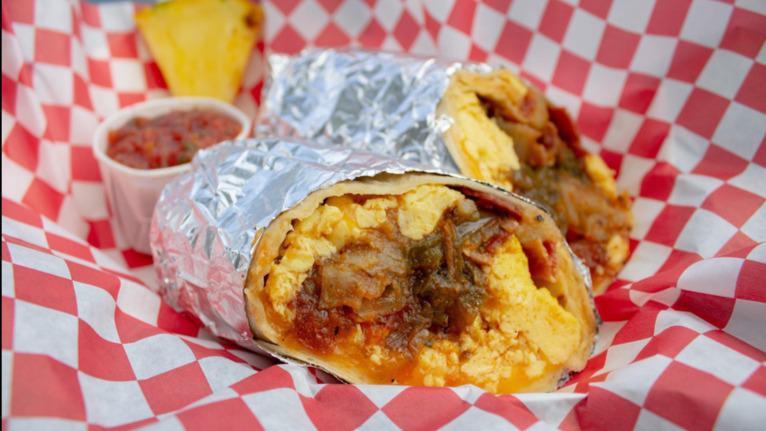 Wendy'S Breakfast Bomber · Grilled tomatoes, onions, green bell peppers and bacon with scrambled eggs, seasoned potatoes and shredded Jack and Cheddar cheese wrapped in a warm flour tortilla.
