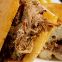 Old School Sandwich · Pork. Popular. 12 hours pulled pork with homemade guava BBQ sauce, cheese, and slaw. Comes w...