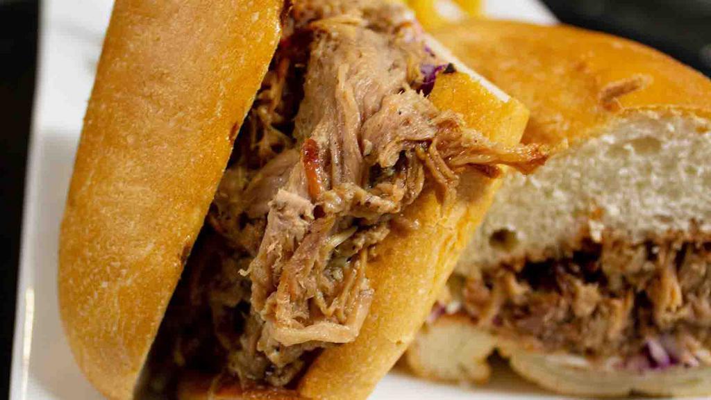 Old School Sandwich · Pork. Popular. 12 hours pulled pork with homemade guava BBQ sauce, cheese, and slaw. Comes with Maui onion potato chips.