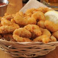 Butterfly Shrimp Basket · Basket of crispy butterfly shrimp basket. Served with Cajun Fries.