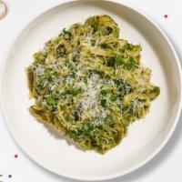 Planet Pesto Pasta  · (Vegetarian) Fresh fettuccine pasta cooked in a pesto sauce and topped with black pepper, pa...
