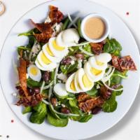 Stake Spinach Salad  · Spinach, feta, bacon, onion, olives, and two hard-boiled eggs tossed with house dressing.