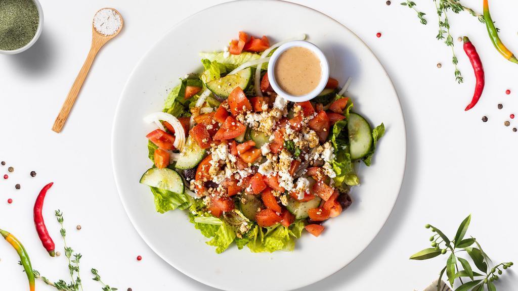 Hearty Greek Salad  · (Vegetarian) Romaine lettuce, cucumbers, tomatoes, red onions, olives, and feta cheese tossed with balsamic vinaigrette dressing.