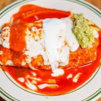 Burrito Mojado · A carnitas burrito covered with salsa roja, melted cheese, avocado salsa & crema.