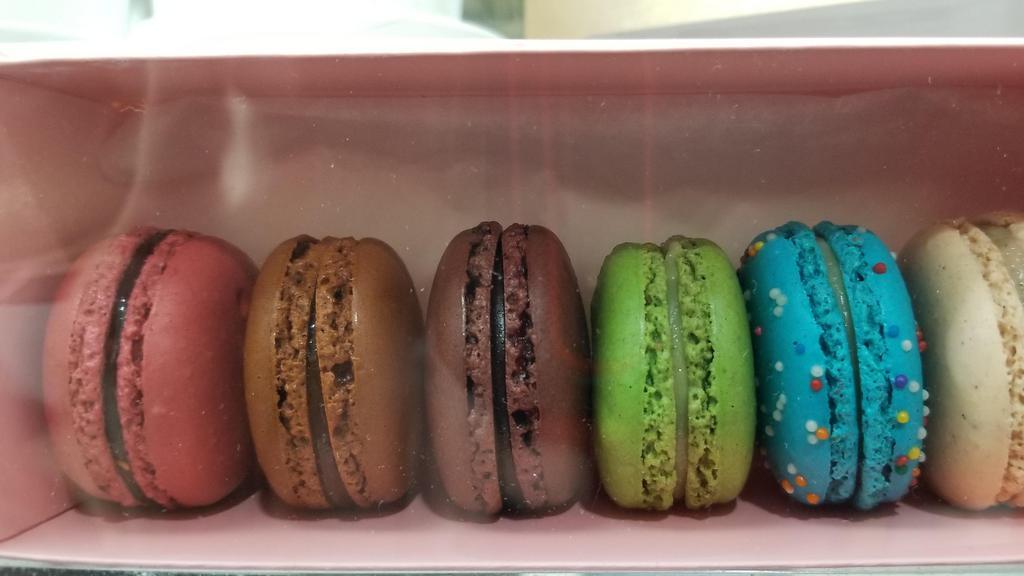 Macarons · a small round cake with a meringue-like consistency, made with egg whites, sugar, and powdered almonds and consisting of two halves sandwiching a creamy filling. Flavors: Chocolate, Raspberry, Pistachio, Salted Caramel, Birthday Cake,Vanilla.