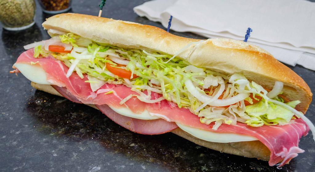 Cold Italian Sandwich · Capicola, ham, prosciutto, salami and provolone cheese. Served with lettuce, tomato, onion, mayo, oil and vinegar on Italian bread.