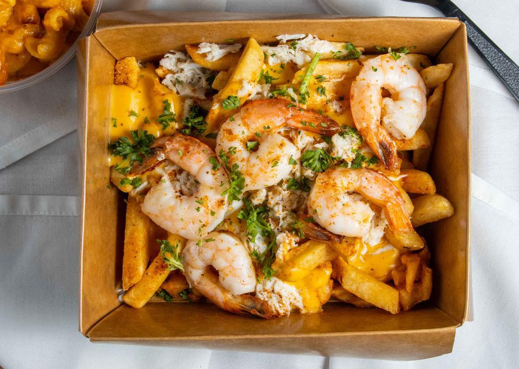 Seafood Loaded Fries · Topped with cheese, sautéed shrimp & fresh lump crab meat.
