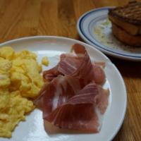Scrambled Eggs  With Prosciutto · Grilled bread