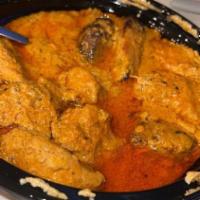 Chicken Tikka Masala · Marinated Boneless chicken barbecued in the tandoor and cooked with the thick tomato gravy, ...