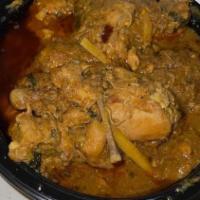 Chicken Curry · Pieces of the chicken with Bone gently cooked with thick curry sauce and Indian spices.