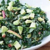 Organic Kale Caesar Salad · Avocado, apples, seasoned croutons, shaved parmesan cheese, and homemade caesar dressing.