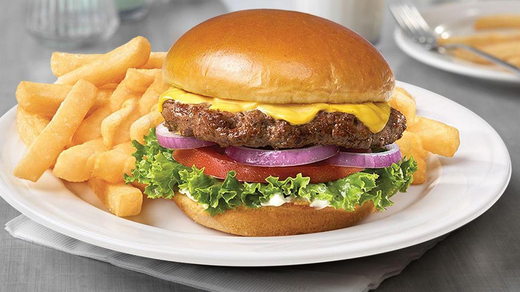 Classic Ed’S Burger · 8 oz. organic angus beef blend served with lettuce, tomato, onions, cheddar cheese, and homemade pickles.