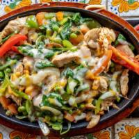 Chinaca · Chicken fajitas with sautéed with garlic, onions, poblano peppers, spinach, tomatoes, green ...