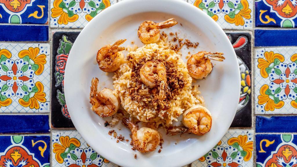 Camarón Al Ajillo · Sautéed shrimp with garlic and white wine wine sauce. Served over rice.
