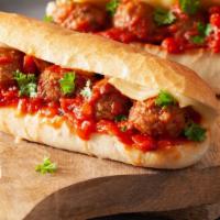 Meatball Parm Hero/Wrap · Piping hot sandwich/wrap with Meatballs, Parmesan cheese, and marinara sauce.